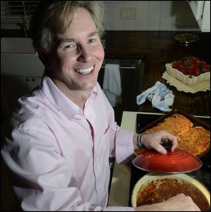 August Post stirs chili in his kitchen in preparation for a small chili party Thursday evening at his Gastonia home. Post is a great party giver who was event director for Martha Stewart and Ralph Lauren.