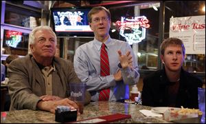 Left to right Lucas County Democratic party chairman Ron Rothenbuhler, Lucas County Republican party chairman Jon Stainbrook , and Jeremiah VanBuren watch the presidential debate last month.