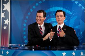 Stephen Colbert reacts to seeing his wax figure for the first time Friday at Madame Tussauds in Washington.