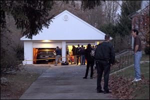Authorities respond to a report of carbon monoxide poisoning last week on Harvest Lane in Toledo. Two hoses were stretched from the exhaust of a running truck, parked inside the garage, pumping toxic fumes into the rear passenger window of the blue Honda Civic where the children – Paige Hayes, 10, Logan Hayes, 7, and Madalyn Hayes, 5 – and the adults – Sandy Ford, 56, and Andy Ford, 32 – sat. All died of carbon monoxide poisoning.