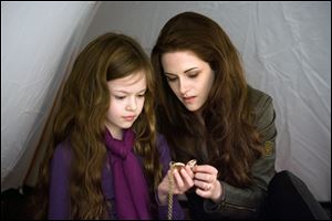 Mackenzie Foy, left, and Kristen Stewart in a scene from The Twilight Saga: Breaking Dawn Part 2.'