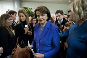 Senate Intelligence Committee Chair Sen. Dianne Feinstein (D., Calif.) is surrounded by reporters after speaking, on Capitol Hill in Washington, Friday, following a committee's closed-door hearing where former CIA Director David Petraeus testified on the Sept. 11, 2012 attack in Libya. 