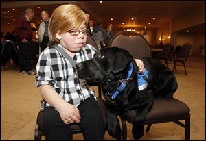 A two-year wait for Andrea Kimett, 19, to have a dog of her own finally became a reality last week when Assistance Dogs for Achieving Independence held its fall graduation. At the event, the leash of Tara, a black Labrador retriever, was handed over.