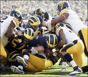 Michigan quarterback Devin Gardner scores a touchdown. The junior scored six on the day.
