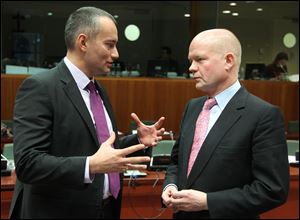 British Foreign Secretary William Hague, right, talks with Bulgarian Foreign Minister Nikolay Mladenov, during the EU foreign ministers meeting at the European Council building in Brussels, Monday. 