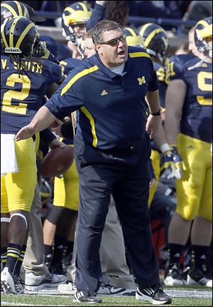 Slug: SPT UMfb17  The Blade/Jeremy Wadsworth  Caption:  Michigan head coach Brady Hoke gives instructions against Iowa Saturday, 11/17/12, at Michigan Stadium in Ann Arbor, Michigan.