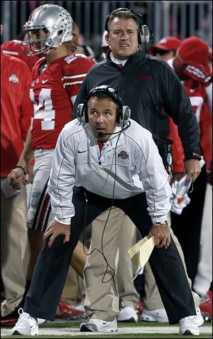 Slug: SPT osufb8p  The Blade/Jeremy Wadsworth  Caption: Ohio State head coach Urban Meyer watches the action against  Nebraska Saturday, 10/06/12, in Columbus, Ohio.