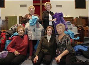 Standing, from left: Nancy Brick, of Millbury, and Marilyn Baker, of Walbridge. Seated, from left: Dian Greenlese, of Walbridge; Janice Mallory, of Millbury; and Judy Sigler, of Walbridge. The women of St. Paul's United Methodist of Millbury have 47 coats they have purchased to be distributed to children in Lake Local Schools.