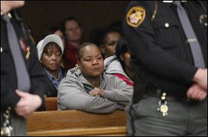 Markeda Holcomb-Brownlee, mother of murder victim CreJonnia Bell, listens during proceedings for Traquawn Gibson in Toledo Municipal Court. He went before a judge Tuesday.