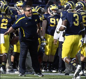 Michigan head coach Brady Hoke gives instructions against Iowa Saturday, 11/17/12, at Michigan Stadium in Ann Arbor.