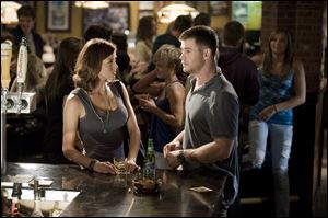 Adrianne Palicki, left, and Chris Hemsworth in a scene from 