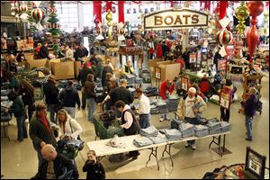 Shoppers investigate Black Friday deals at Bass Pro Shop.