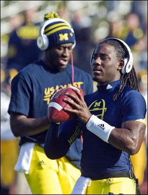 To date, Denard Robinson holds the NCAA single-season record for rushing yards by a quarterback (1,702 yards, set in 2010), and is third in the NCAA and holds the Big Ten all-time mark for career rushing yards by a quarterback (4,273 yards).
