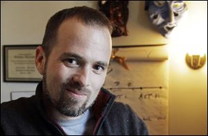 Author William Alexander poses in his Minneapolis home. Alexander won the Young People's Literature Prize at the National Book Awards in New York on Wednesday for his debut novel, 