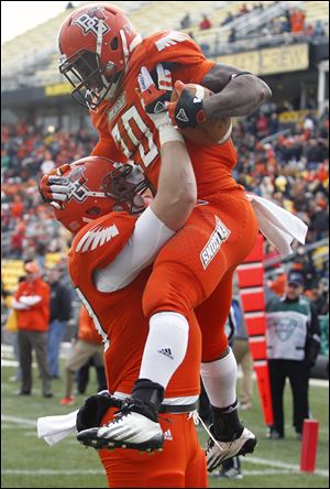 BG tailback  John Pettigrew, right, celebrates his TD with fullback Tyler Beck on Friday in Columbus.