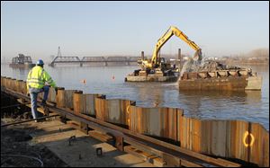 Dredging the Maumee River at the Ironville Dock site in East Toledo has a target of providing a water depth of 27 feet. The dock site is at the former Gulf Oil refinery along Front Street.