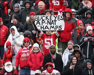 Ohio State fans cheer the victorious and undefeated Buckeyes.