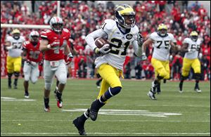 Michigan wide receiver Roy Roundtree scores a first-quarter touchdown against Ohio State on Saturday in Columbus.  He three passes for 92 yards and a touchdown in a 26-21 loss.