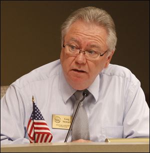 Greg Stewart, the new Bedford Township supervisor, attends his first Bedford Township Board meeting recently at the Bedford Township Hall in Temperance, Mich.