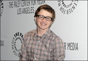Actor Angus T. Jones arrives at the Paleyfest panel discussion of the television series 