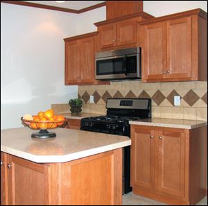 The kitchen boasts an attractive work island and all-new
Frigidaire appliances.