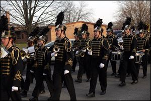 The Perrysburg High School marching band makes its way down Elm Street during the parade. Mayor Nelson Evans said the ‘Home for the Holidays’ theme of the event brought out togetherness.  