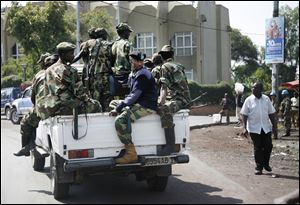 M23 rebels patrol around Congo's Central Bank in Goma, eastern Congo, Monday.