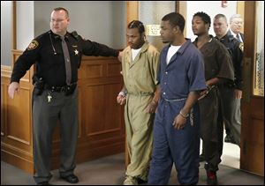  Keshawn Jennings, Antwaine Jones, and James Moore, enter Lucas County Common Pleas Court, Thursday, October 11,  2012. 