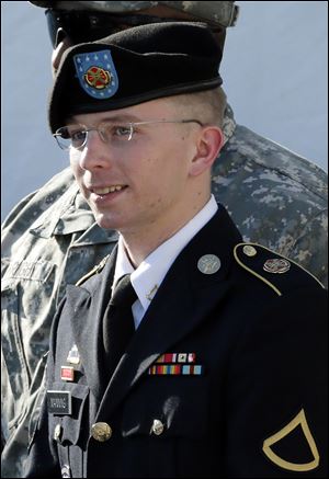 Army Pfc. Bradley Manning is escorted out of a courthouse in Fort Meade, Md., after a pretrial hearing.