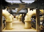  A series of pipes carries water through Toledo's Collins Park water treatment plant. City Council voted to raise water rates to pay for regional water system repairs. 