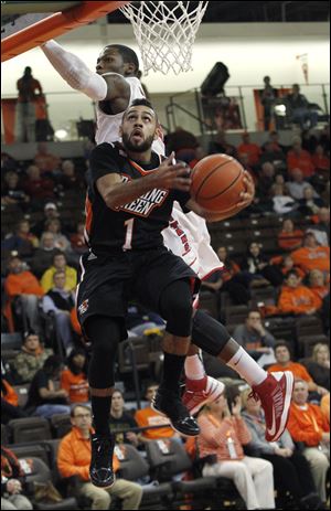 BGSU's Jordon Crawford gets past Detroit's Doug Anderson for a layup at the Stroh Center. Crawford scored a team-high 26 points.