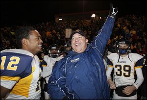 Whitmer coach Jerry Bell celebrates a victory in the state semifinals. The Panthers have reached the state final for the first time.