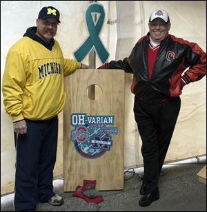 Jason Cowell and Jeff Steinke take on the Border Battle Bash Cornhole Boards. 