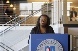 Center director Jonee Lee speaks at the dedication ceremony at St. Francis de Sales High School. The center opened this fall to students, parents, faculty, and alumni.