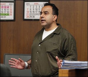 Koray Ergur argues with Judge C. Allen McConnell in Toledo Municipal Housing Court. Mr. Ergur, who owns downtown buildings, is accused of fire code violations.