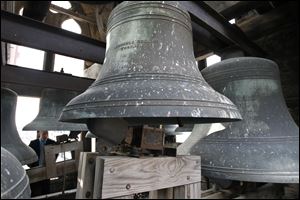 The Gardner Chimes, a set of 12 bells at Trinity Episcopal Church on Adams Street in downtown Toledo, are examined by JJ Smith, president of Smith’s Bell and Clock Service Inc. of Mooresville, Ind. 