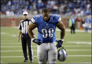 Detroit's Ndamukong Suh leaves the field after the Lions blew a late lead to fall to the Colts. The Lions are now 4-8 on the season.