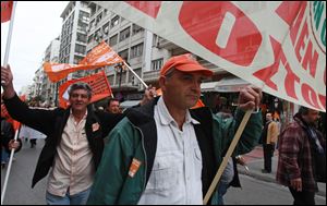 Municipal employees protest during a work stoppage by public sector union Friday in Athens. Several hundred people took part in the peaceful demonstration. Greek municipal workers have occupied hundreds of town halls across the country to protest against government plans to suspend 2,000 civil servants due to state budget cuts.