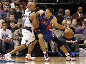 Detroit Pistons forward Tayshaun Prince (22) battles Dallas Mavericks guard Derek Fisher (6) for space during the second half of Saturday's game in Dallas.