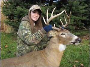 Katelyn Spalding, 17, a junior at Anthony Wayne High School, shows off the 10-point buck she took last month.