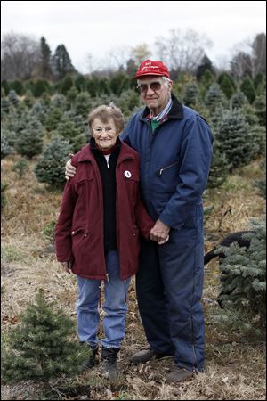 Peg and Wilbur Matthes at their evergreen tree farm in Ida, Mich.