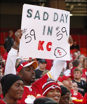 A Kansas City Chiefs fan holds a sign during the first half of an NFL football game against the Carolina Panthers at Arrowhead Stadium in Kansas City, Mo., Sunday.