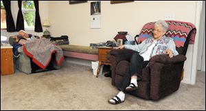 LouVee Walker, 75, of Sweet Home, Ore., sits at home with her husband, Jim, who has Lewy body dementia. The Walkers live next to the home where Jim was born. He can do little for himself now. LouVee washes, dresses and feeds him.I never think about not doing it, LouVee said.