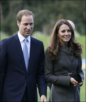 Britain's Prince William, left, and his wife Kate, the Duchess of Cambridge. The Duchess of Cambridge is expecting a baby, St James's Palace officially announced Monday.