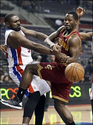 Detroit's Jason Maxiell, left, and Cleveland's Jeremy Pargo fight for the ball. The Pistons improved to 6-13. The Cavs fell to 4-14.