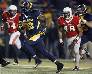 Toledo running back David Fluellen (22) scores a touchdown against Ball State last month.