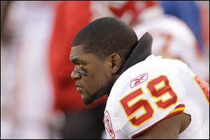 Kansas City Chiefs' Jovan Belcher sits on the sidelines during a game in December, 2011. Police say Belcher fatally shot his girlfriend early Saturday, then drove to Arrowhead Stadium and committed suicide in front of his coach and general manager. 