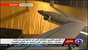 In this image taken from the Iranian state TV's Arabic-language channel Al-Alam, showed what they purport to be an intact, caputured ScanEagle drone aircraft put on display, as an exclusive broadcast.