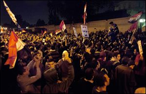 Egyptian protesters chant anti Muslim Brotherhood slogans during a demonstration in front of the presidential palace in Cairo.