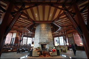 Cozy seating areas surround the stone fireplace column at the Ritz-Carlton Lake Tahoe.